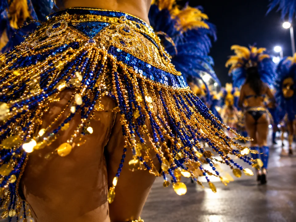 A sequined samba costume skirt in gold and royal blue swinging in motion